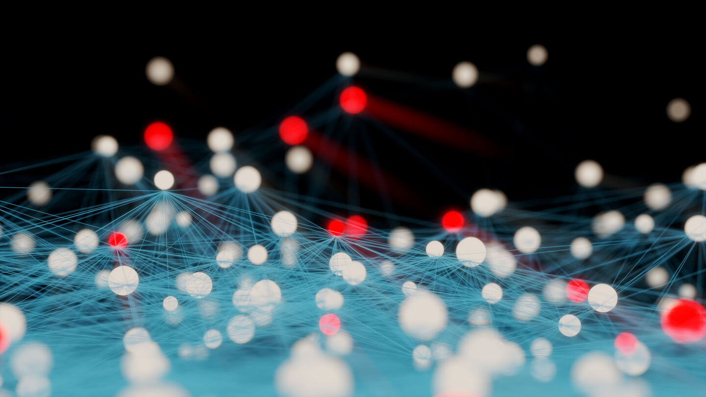 Vernetzte weiße und rote Kugeln, verbunden durch dünne Linien auf dunklem Hintergrund